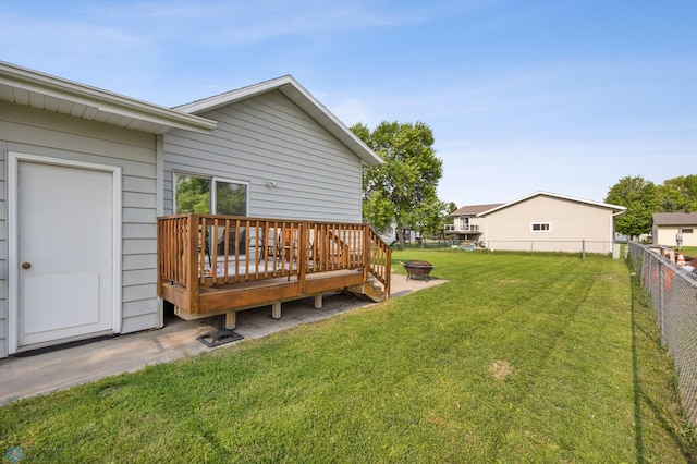 805 7th St NE, Dilworth, MN 56529 - view of yard featuring a wooden deck and a fire pit