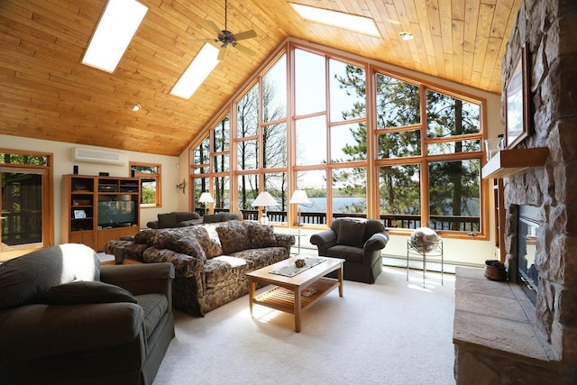 1880 Everett Rd S, Greenwood Twp, MN 55790 - carpeted living room featuring a skylight, high vaulted ceiling, a wall mounted air conditioner, and a fireplace