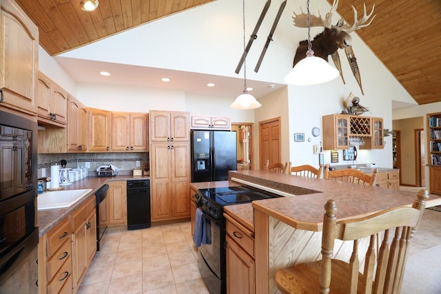 1880 Everett Rd S, Greenwood Twp, MN 55790 - kitchen featuring black appliances, high vaulted ceiling, a kitchen bar, wood ceiling, and backsplash