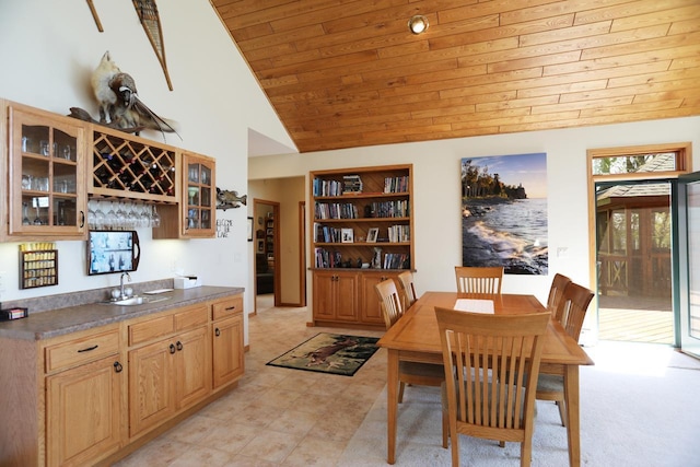 1880 Everett Rd S, Greenwood Twp, MN 55790 - dining room with wooden ceiling, vaulted ceiling, light carpet, and built in features