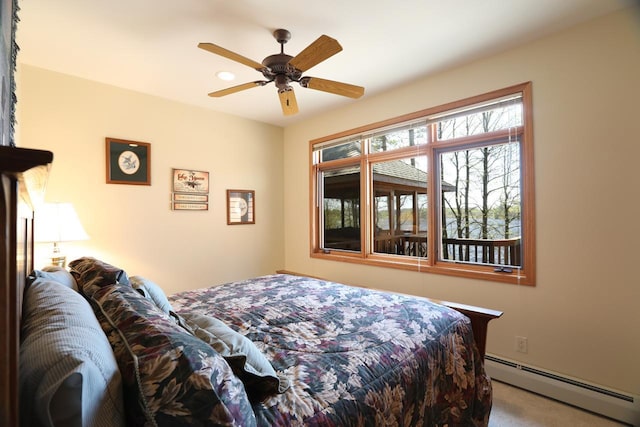 1880 Everett Rd S, Greenwood Twp, MN 55790 - carpeted bedroom featuring a baseboard radiator and ceiling fan