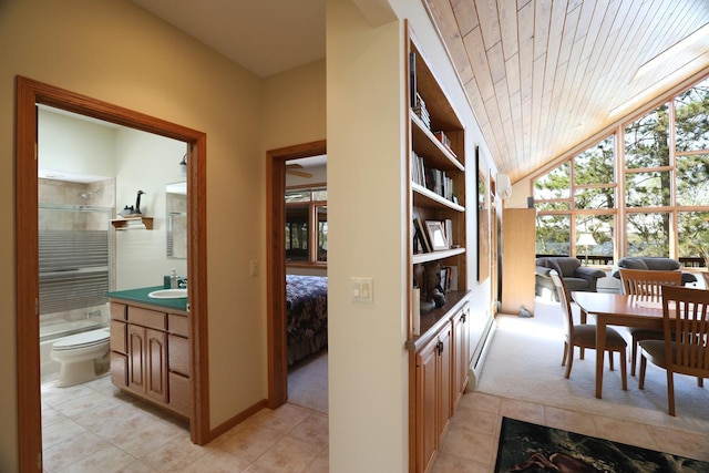1880 Everett Rd S, Greenwood Twp, MN 55790 - corridor with light tile patterned flooring, light colored carpet, vaulted ceiling, a sink, and wood ceiling