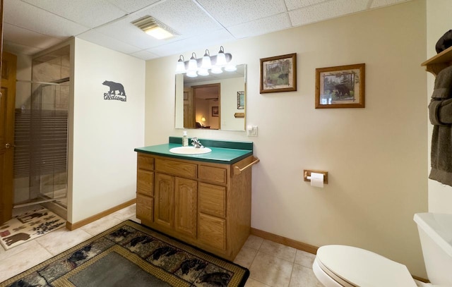 1880 Everett Rd S, Greenwood Twp, MN 55790 - bathroom with vanity, toilet, a stall shower, baseboards, and tile patterned floors