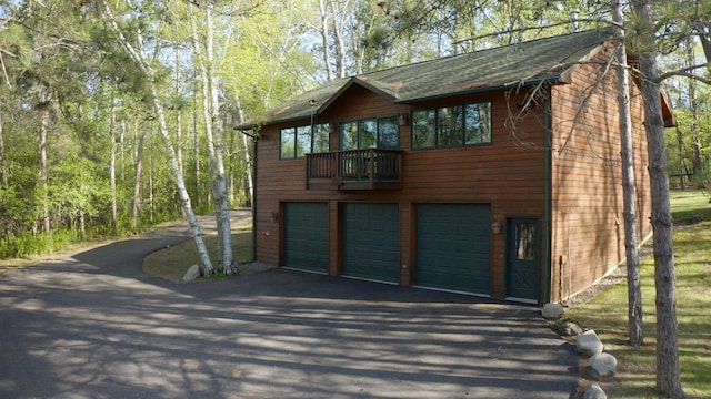1880 Everett Rd S, Greenwood Twp, MN 55790 - garage featuring asphalt driveway