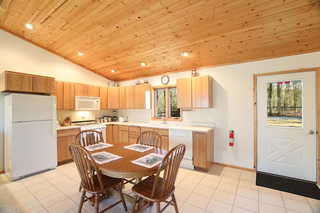 1880 Everett Rd S, Greenwood Twp, MN 55790 - kitchen with white appliances, vaulted ceiling, wooden ceiling, light countertops, and light tile patterned flooring