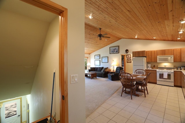 1880 Everett Rd S, Greenwood Twp, MN 55790 - kitchen featuring white appliances, lofted ceiling, wood ceiling, brown cabinets, and light countertops