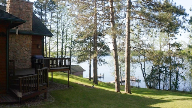1880 Everett Rd S, Greenwood Twp, MN 55790 - view of green lawn featuring a deck with water view
