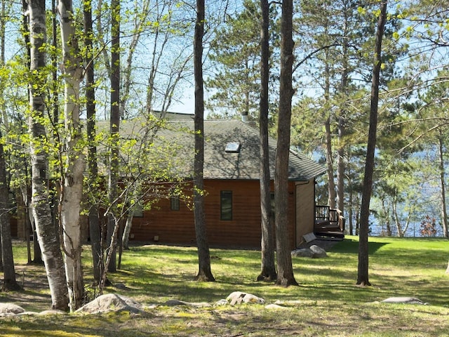 1880 Everett Rd S, Greenwood Twp, MN 55790 - view of property exterior featuring a lawn and roof with shingles