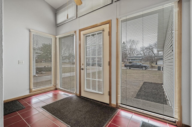 4017 Fordham Dr NE, Saint Anthony, MN 55421 - doorway to outside with tile patterned floors and baseboards