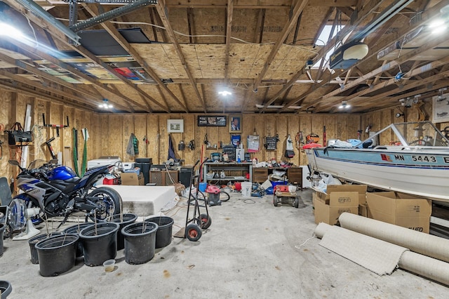 4017 Fordham Dr NE, Saint Anthony, MN 55421 - garage featuring a workshop area and a garage door opener