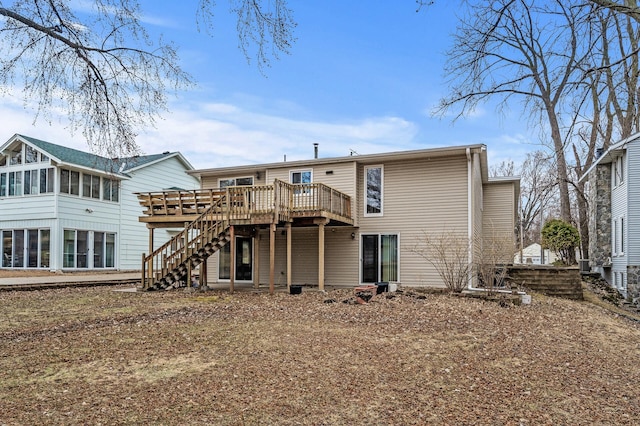 4017 Fordham Dr NE, Saint Anthony, MN 55421 - rear view of house featuring a deck and stairway