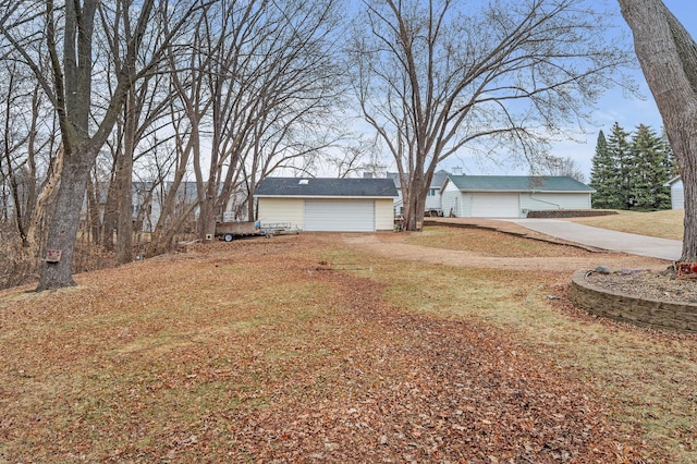 4017 Fordham Dr NE, Saint Anthony, MN 55421 - view of green lawn with driveway and a garage