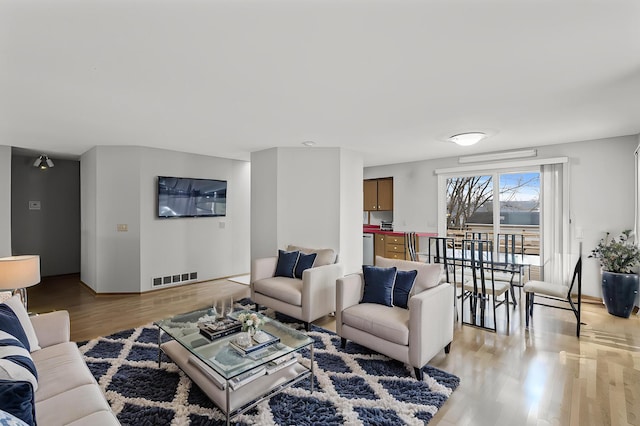 4017 Fordham Dr NE, Saint Anthony, MN 55421 - living area with light wood-style flooring and baseboards