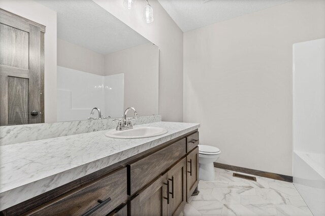 872 Watertown Ave, Delano, MN 55328 - full bathroom with vanity, marble finish flooring, a shower, and toilet