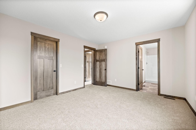 872 Watertown Ave, Delano, MN 55328 - unfurnished bedroom with light colored carpet and baseboards