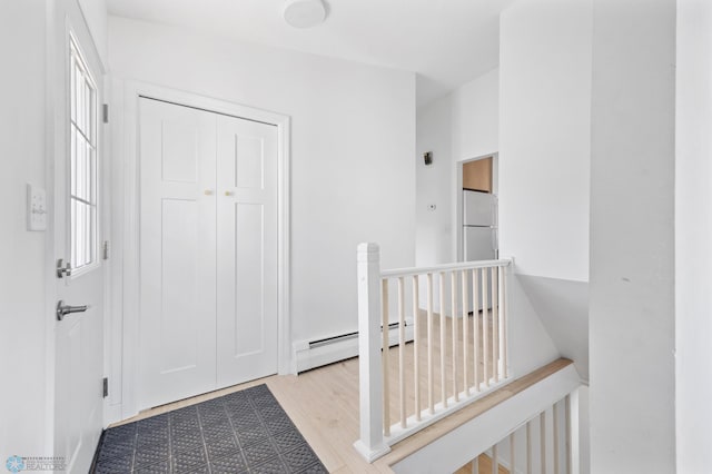 3017 8th St N, Fargo, ND 58102 - corridor with an upstairs landing and a baseboard heating unit