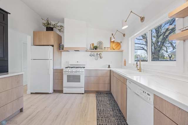 3017 8th St N, Fargo, ND 58102 - kitchen with white appliances, open shelves, a sink, light countertops, and light wood-style flooring