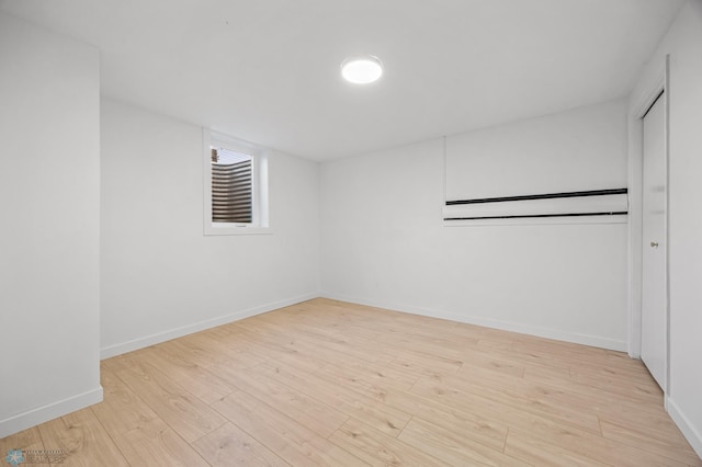 3017 8th St N, Fargo, ND 58102 - unfurnished bedroom with wood finished floors, baseboards, and a closet