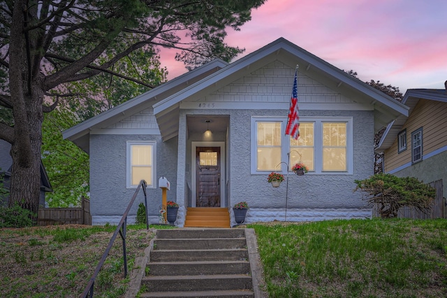 4245 11th Ave S, Minneapolis, MN 55407 - bungalow-style house featuring stucco siding