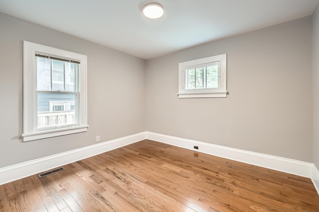 4245 11th Ave S, Minneapolis, MN 55407 - empty room with wood finished floors and baseboards