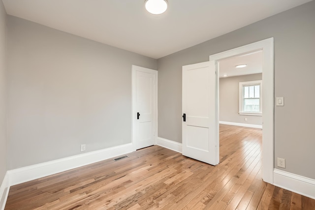 4245 11th Ave S, Minneapolis, MN 55407 - unfurnished room with light wood finished floors and baseboards