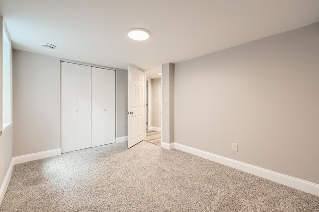 4245 11th Ave S, Minneapolis, MN 55407 - unfurnished bedroom with light carpet, baseboards, and a closet