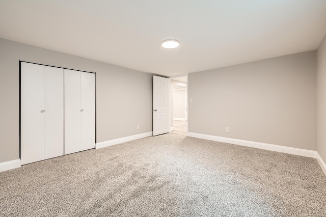 4245 11th Ave S, Minneapolis, MN 55407 - unfurnished bedroom featuring carpet floors, baseboards, and a closet