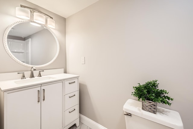 4245 11th Ave S, Minneapolis, MN 55407 - bathroom with toilet, baseboards, and vanity