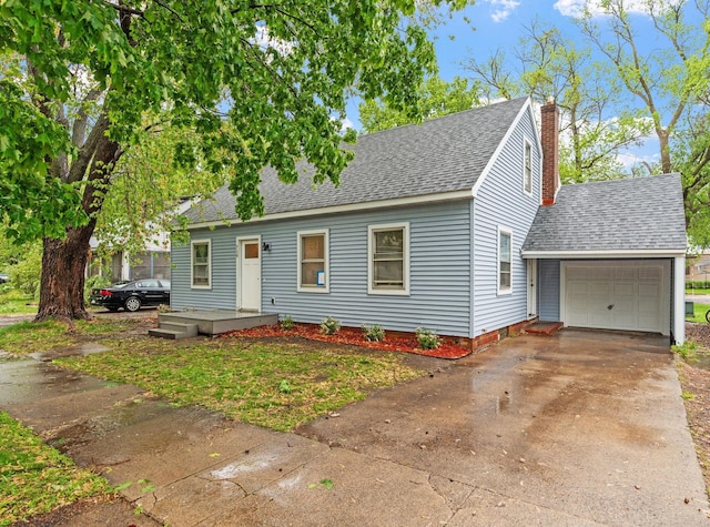 719 9th St E, Glencoe, MN 55336 - new england style home with a shingled roof, driveway, an attached garage, and a chimney