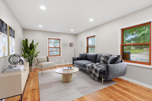 719 9th St E, Glencoe, MN 55336 - living area with healthy amount of natural light, light wood-type flooring, recessed lighting, and baseboards