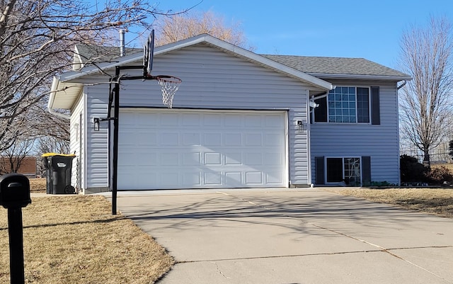 218 10th Ave NW, Byron, MN 55920 - view of front facade featuring concrete driveway and a garage