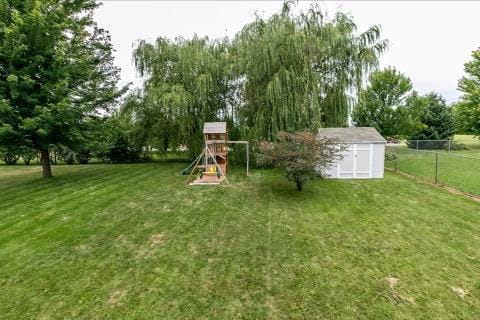 218 10th Ave NW, Byron, MN 55920 - view of yard featuring a playground and view of scattered trees