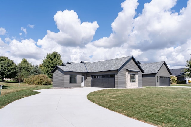 724 Westland Ln, New London, MN 56273 - view of front of property with a front yard, a garage, concrete driveway, and roof with shingles
