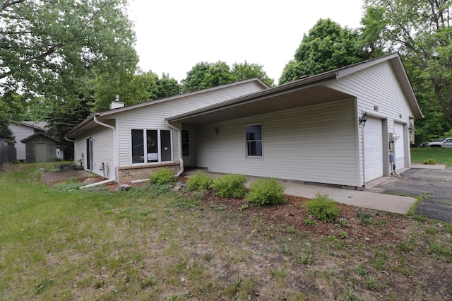 16477 Five Hawks Ave SE, Prior Lake, MN 55372 - view of front facade featuring a chimney, a garage, and a storage unit