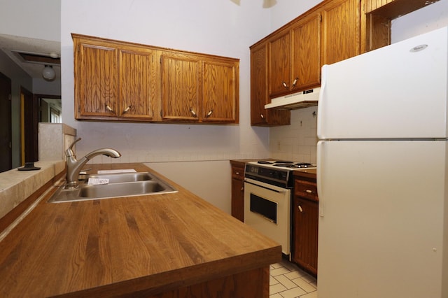 16477 Five Hawks Ave SE, Prior Lake, MN 55372 - kitchen featuring white appliances, under cabinet range hood, wood counters, a sink, and tasteful backsplash