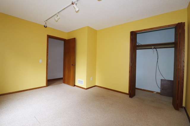 16477 Five Hawks Ave SE, Prior Lake, MN 55372 - unfurnished bedroom with carpet, a closet, baseboards, and track lighting
