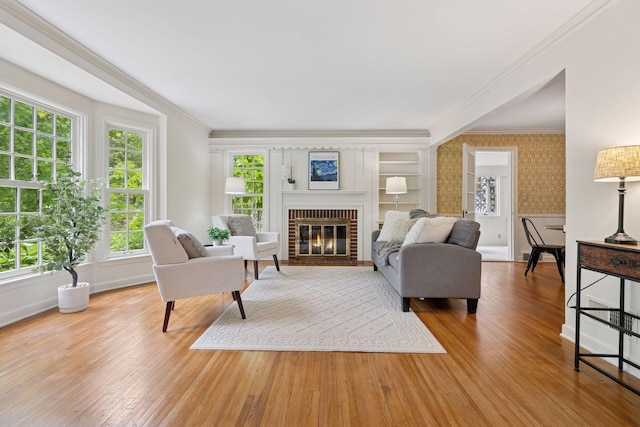 4378 Browndale Ave, Edina, MN 55424 - living area with crown molding, wallpapered walls, light wood-type flooring, a brick fireplace, and baseboards