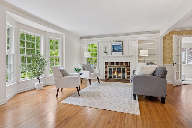 4378 Browndale Ave, Edina, MN 55424 - living area with crown molding, wood finished floors, a brick fireplace, and baseboards