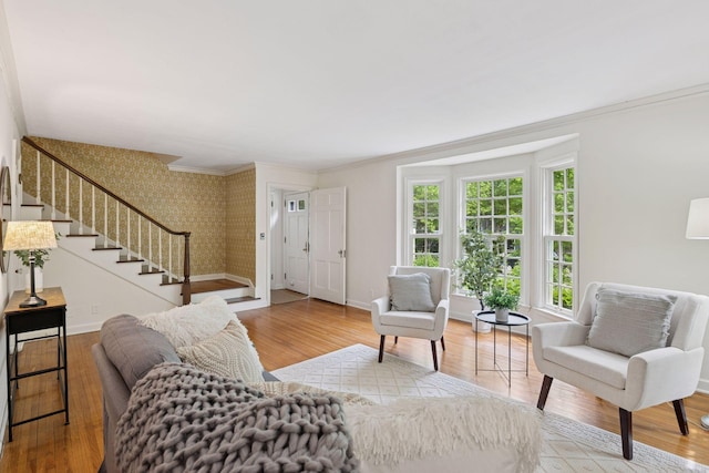 4378 Browndale Ave, Edina, MN 55424 - living area with wallpapered walls, baseboards, wood finished floors, stairway, and ornamental molding