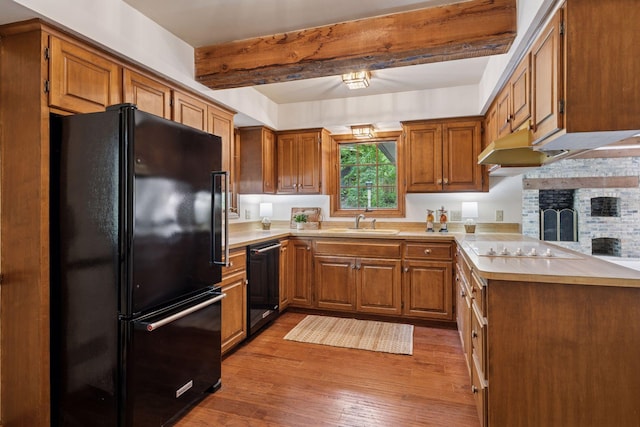 4378 Browndale Ave, Edina, MN 55424 - kitchen featuring black appliances, a sink, light countertops, beam ceiling, and light wood-type flooring