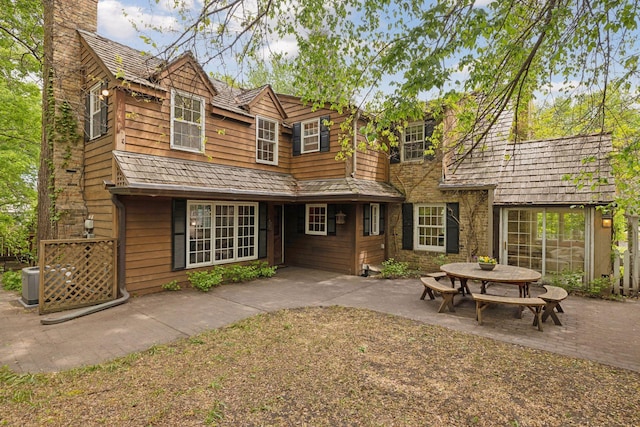 4378 Browndale Ave, Edina, MN 55424 - back of house featuring a patio area, a chimney, and central AC unit