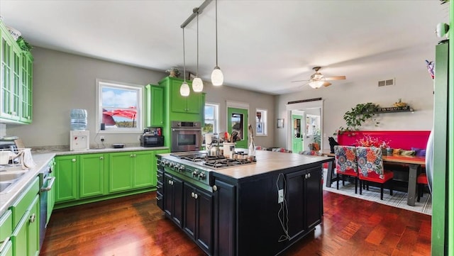 19334 105th Ave, Hayland Twp, MN 56353 - kitchen with gas stovetop, oven, light countertops, and dark wood-style flooring