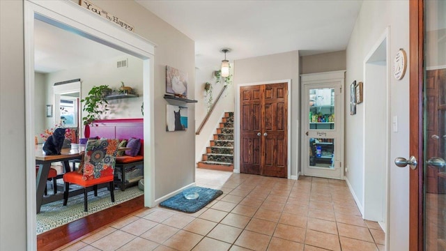 19334 105th Ave, Hayland Twp, MN 56353 - foyer with light tile patterned floors and stairs