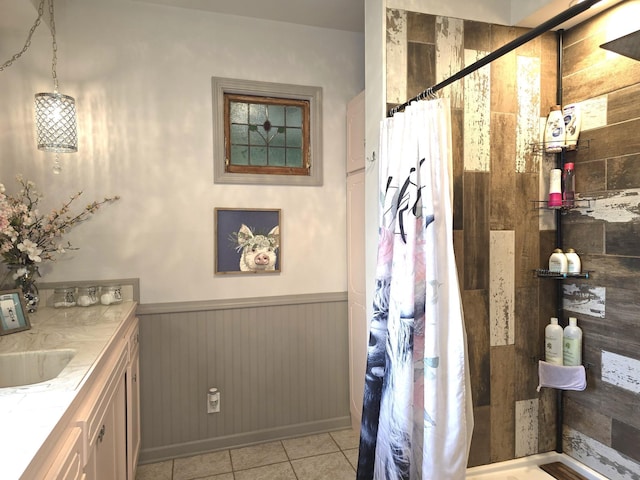 19334 105th Ave, Hayland Twp, MN 56353 - bathroom featuring tile patterned flooring, a tile shower, vanity, a wainscoted wall, and wood walls