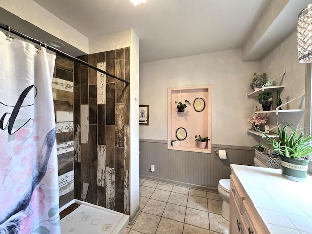 19334 105th Ave, Hayland Twp, MN 56353 - bathroom featuring wainscoting, a shower stall, tile patterned flooring, and vanity