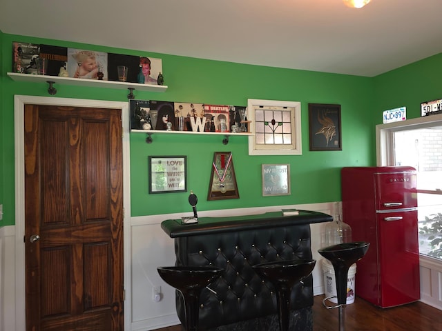 19334 105th Ave, Hayland Twp, MN 56353 - bar area featuring wood finished floors and a wainscoted wall