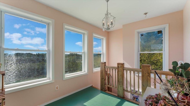 19334 105th Ave, Hayland Twp, MN 56353 - sunroom featuring a chandelier
