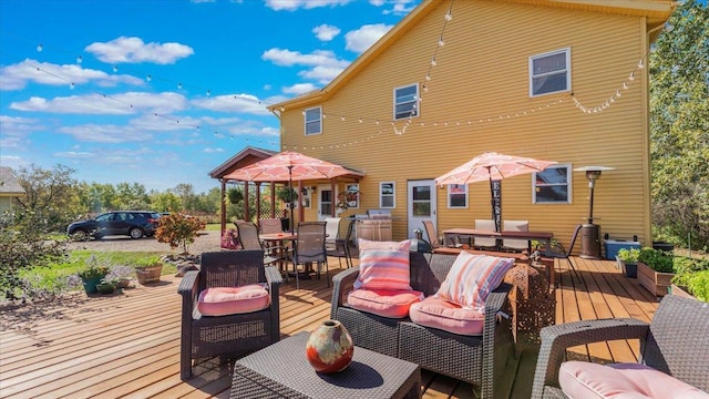 19334 105th Ave, Hayland Twp, MN 56353 - wooden deck with outdoor dining space and an outdoor hangout area