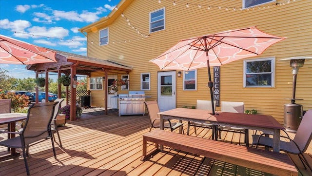 19334 105th Ave, Hayland Twp, MN 56353 - deck with outdoor dining space and a gazebo