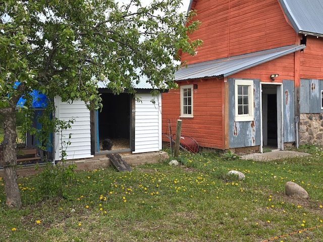 19334 105th Ave, Hayland Twp, MN 56353 - back of property with a metal roof and a lawn